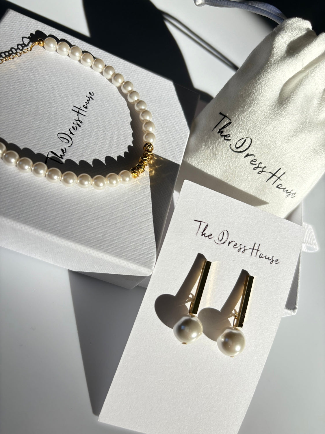 Ruby Jocelyn - Pearl Gold Earring Bracelet Set